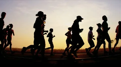 Silhouette runners on racing track   Stock Footage