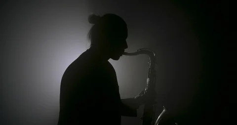 Silhouette of a saxophone player 스톡 동영상 103646878
