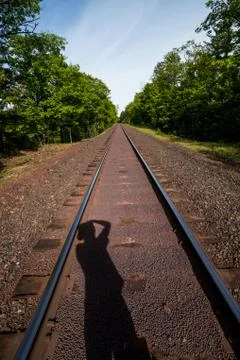 Silhouette shadow on train track Stock Photos