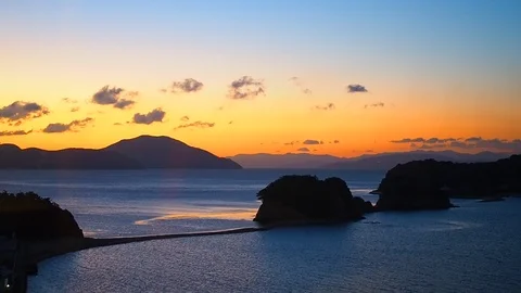 Silhouette Shidoshima Angle Road with orange morning sunrise Stock Footage 100413473