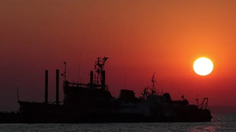 Silhouette Of Ship On The Background Of Sunset On A Summer Evening. A Seagull Bi 스톡 동영상 170648058