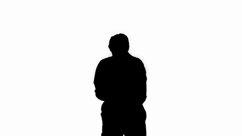 Silhouette Single construction worker puts on safety hat and does some cool Stock Footage 114994453