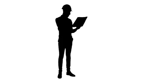 Silhouette Site manager talking on mobile phone holding blueprints Видео 73623099