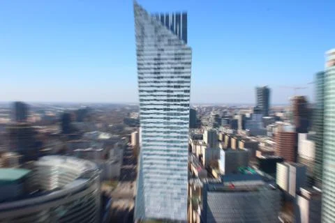 The silhouette of a skyscraper, the blur of the object, the look of a man wit Stock Photos