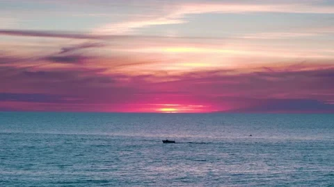 Silhouette of small boat sunset background Stock Footage 190071449