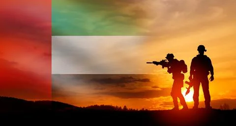 Silhouette of soldiers against the flag of UAE. Concept of national holidays. Stock Photos