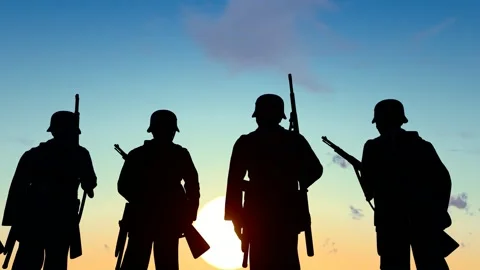 The silhouette of soldiers standing guard in the setting sun Stock Footage 327945937