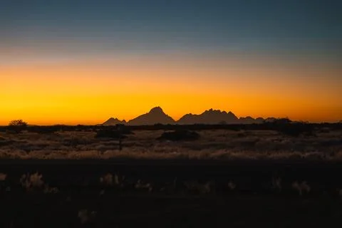Silhouette of Spitzkoppe mountains at sunset in Namibia 스톡 사진