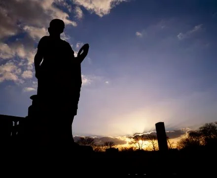 Silhouette of statue Stock Photos