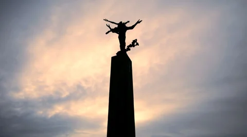 Silhouette statue. time lapse. time passing. sunset sky Stock Footage 36206308