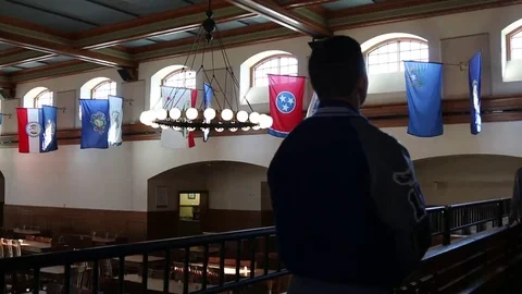 Silhouette of Student Cadet with Flags in Background Stock Footage 69231263