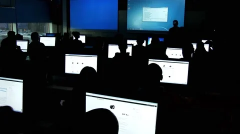 Silhouette students in a computer classroom working with unity software for game Stock Footage 48709607
