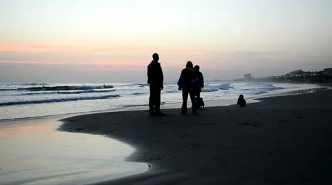 Silhouette of sunset on the beach people playing 스톡 동영상 12636645