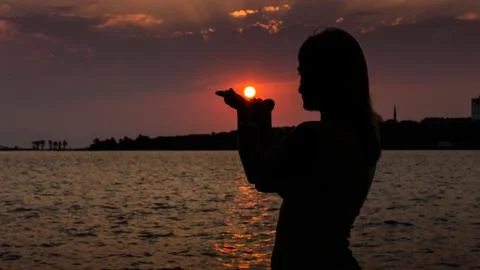 Silhouette at sunset Stock Photos