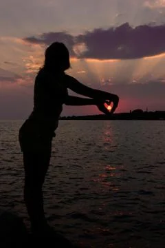 Silhouette at sunset Stock Photos