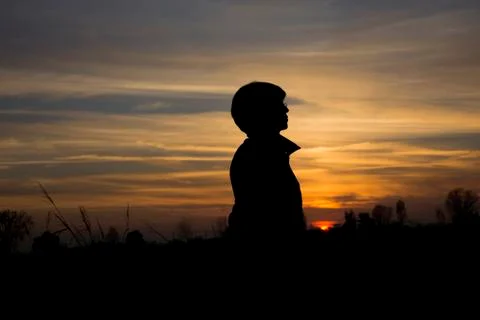 Silhouette at sunset Stock Photos