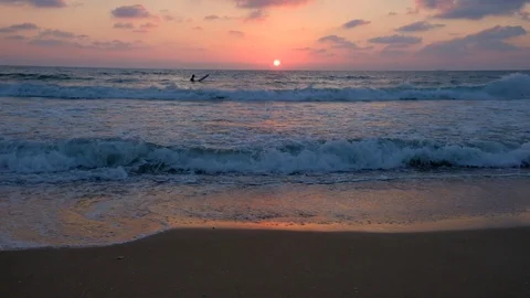 Silhouette of a surfer on a background of the sunset Stock Footage 111489105