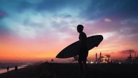 Silhouette of a Surfer At a Beach During Magic Hour Stock Photos
