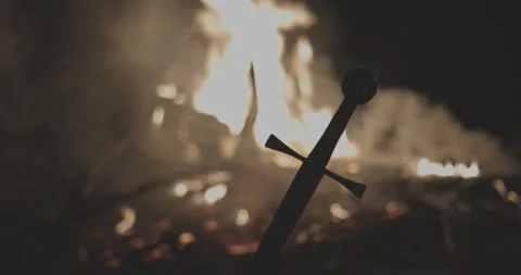 Silhouette of templar sword against fire #2 Stock Footage 150128335