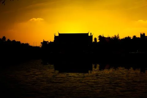 Silhouette temple with river reflection sunset Stock Photos