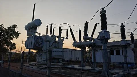 Silhouette of temporary high voltage electrical power substation transformer. Stock Photos