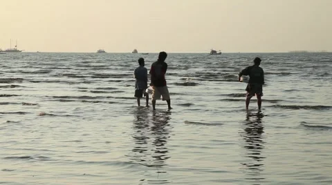 Silhouette Three men flow along the shallows sky sea breeze ebb tide coastline Stock Footage 46708128