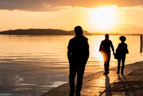 Silhouette of three people Stock Photos