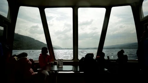 A silhouette of Tourist Passengers on boat at Loch Ness. Stock Footage