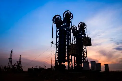The silhouette of tower type pumping unit Stock Photos