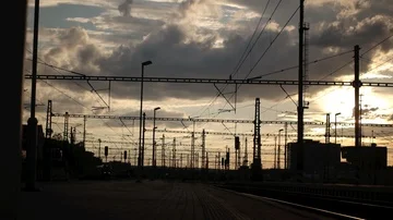 Silhouette of a train arrived at the train-station in sunset Stock Footage 85477591