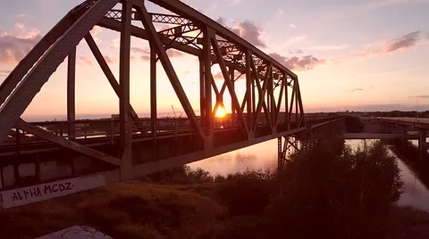 Silhouette of a train bridge at sunset Stock Footage 43887542