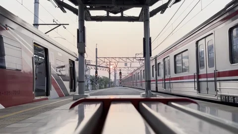 Silhouette of Train Driver at Railway Platform with Commuter Train in Bekasi Stock Footage 339327047
