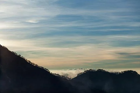 Silhouette of trees growing on the mountain range. Trek to Mount Rinjani, Lombok Stock Photos