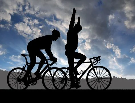 Silhouette of two cyclists Stock Photos