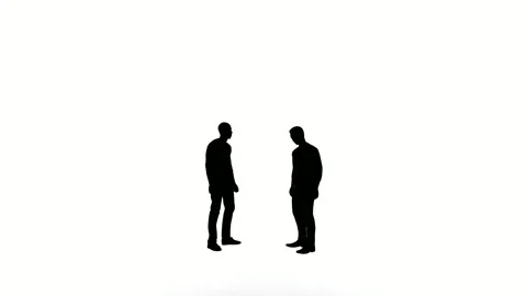 two people standing and talking