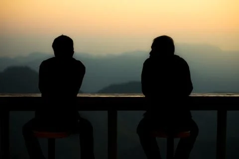 Silhouette two man talking each other Stock Photos