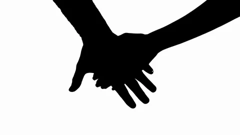 two people silhouette holding hands
