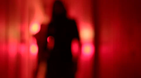 Silhouette of two sexy women dancing in a blurry, red corridor. 動画素材 59553463
