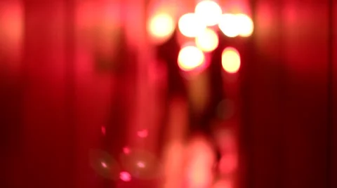 Silhouette of two sexy women in high heels dancing in a blurry, red corridor Stock Footage 59553411