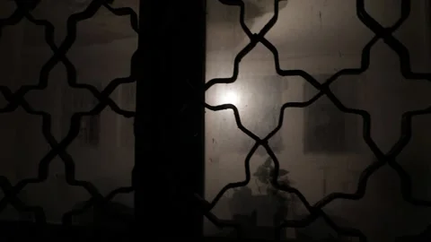 Silhouette of an unknown shadow figure on a door through a closed glass door. Stock Footage 222650606