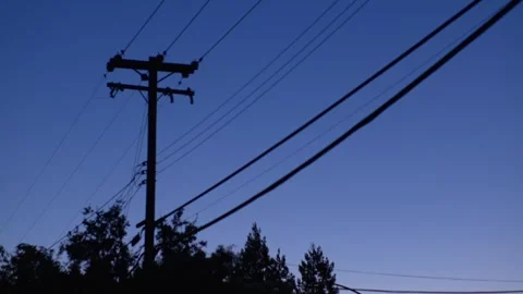 Silhouette Of Utility Pole And Power Lines At Dusk Stock Footage 346156926