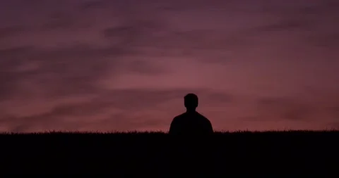 Silhouette Walking at Sunset (Medium) Stock Footage