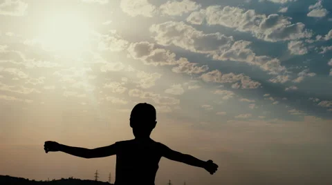 Silhouette on Wind of a Boy on the Background of Sunset Shows How Spacious and Stock Footage 67263307