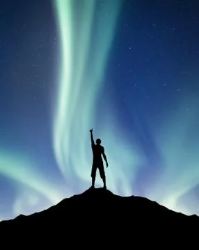Silhouette of a winner on the northen light background Stock Photos