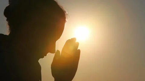 Silhouette of woman head, she is praying Stock Footage