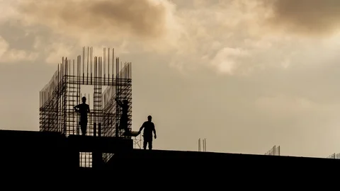 Silhouette workers working on construction site, builders working golden hour Stock Footage 108120569