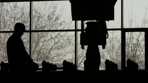 Silhouette of the working person Stock Footage 72611631
