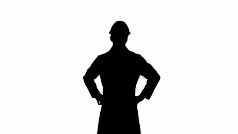 Silhouette A young engineer putting dafety hat on. 스톡 동영상 114995590