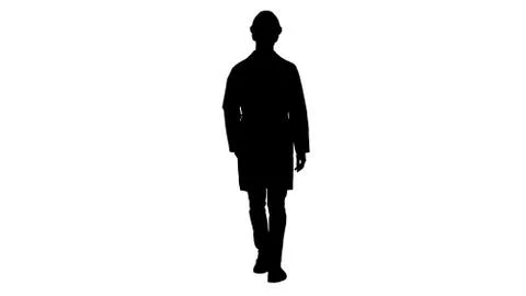 Silhouette Young engineer in robe and helmet putting glasses on while walking. Illustrazione stock