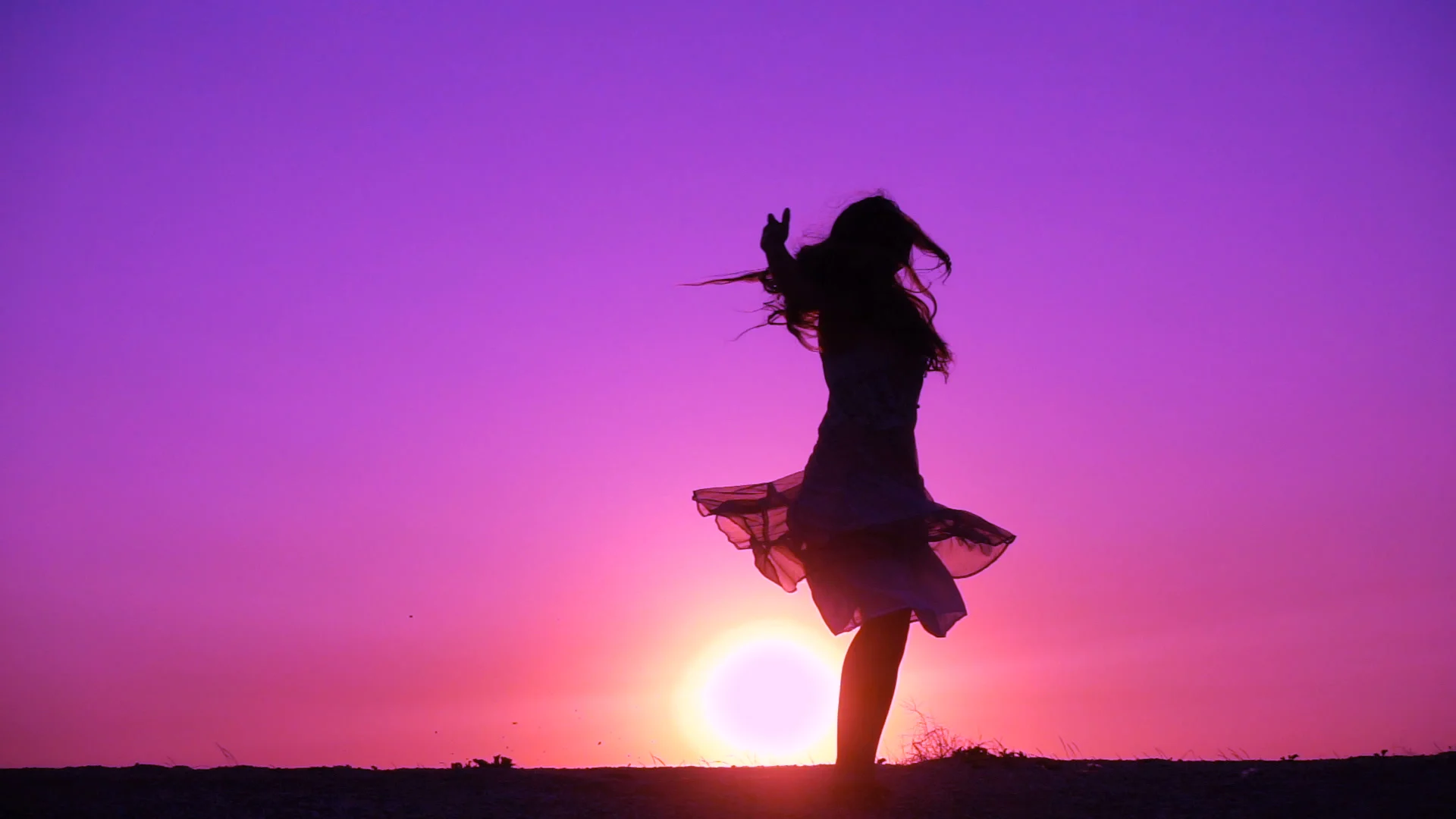 silhouette-young-girl-dancing-against-fo